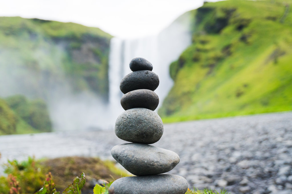 Cairn stone, a structure of rocks stacked one on top of another, looking like it might collapse any second.