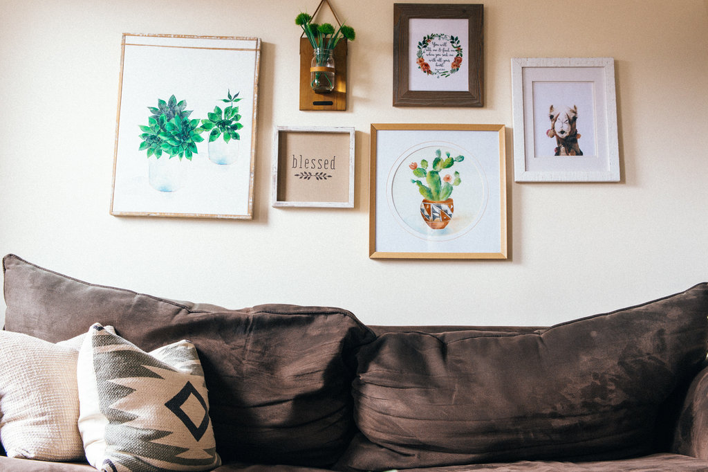 White and green floral wall decor with the word "blessed" at the center.